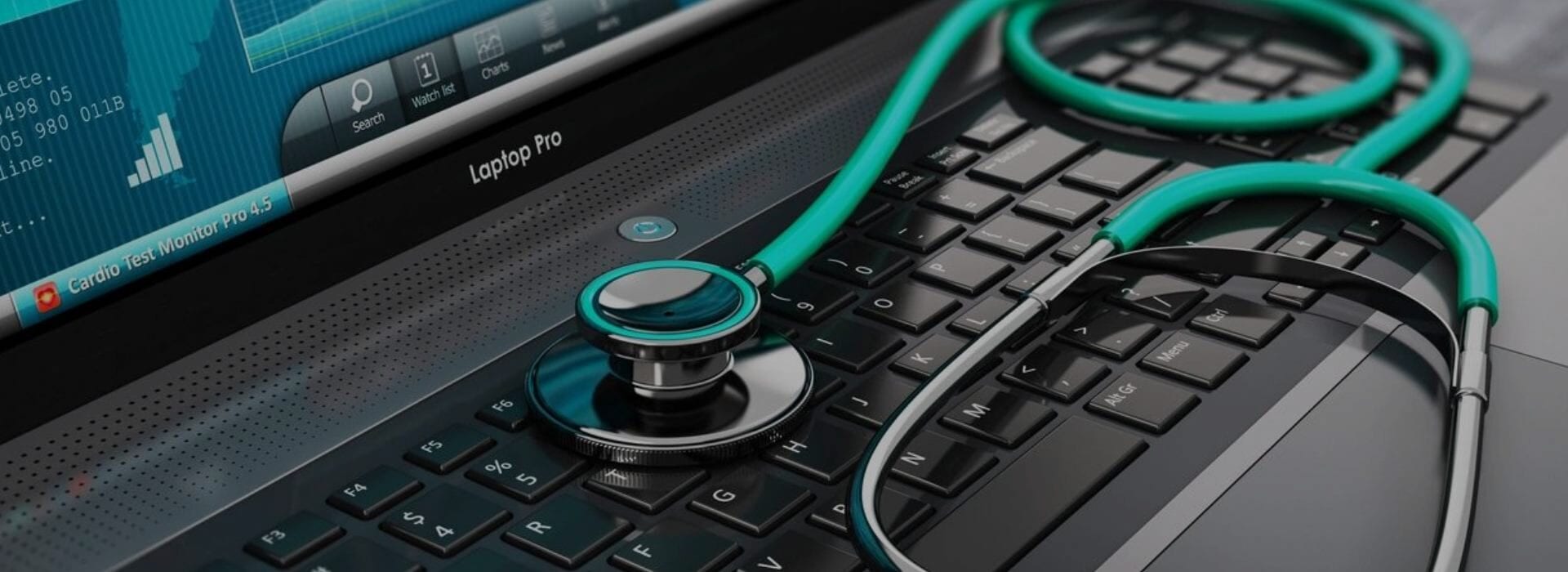 A stethoscope is sitting on top of a laptop.